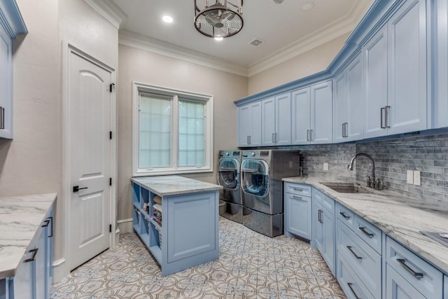 7212 John Mccain Rd, Colleyville, TX 76034 - washroom with washing machine and clothes dryer, cabinet space, crown molding, and light tile patterned floors
