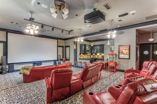 7212 John Mccain Rd, Colleyville, TX 76034 - carpeted cinema room with rail lighting, ceiling fan, crown molding, and baseboards