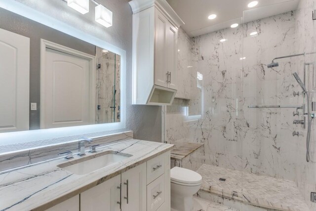 7212 John Mccain Rd, Colleyville, TX 76034 - bathroom with toilet, a marble finish shower, vanity, recessed lighting, and marble finish flooring