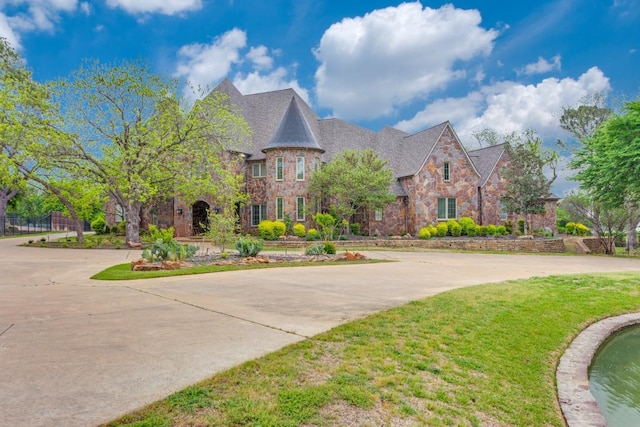 7212 John Mccain Rd, Colleyville, TX 76034 - view of front of home featuring stone siding and a front lawn