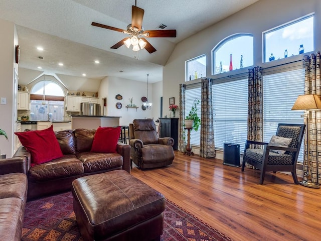 3214 Pecan Meadow Dr, Garland, TX 75040 - living area with ceiling fan, wood finished floors, recessed lighting, and high vaulted ceiling