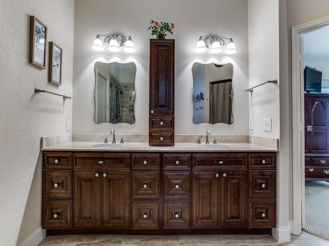 3214 Pecan Meadow Dr, Garland, TX 75040 - bathroom with double vanity, a shower, and baseboards