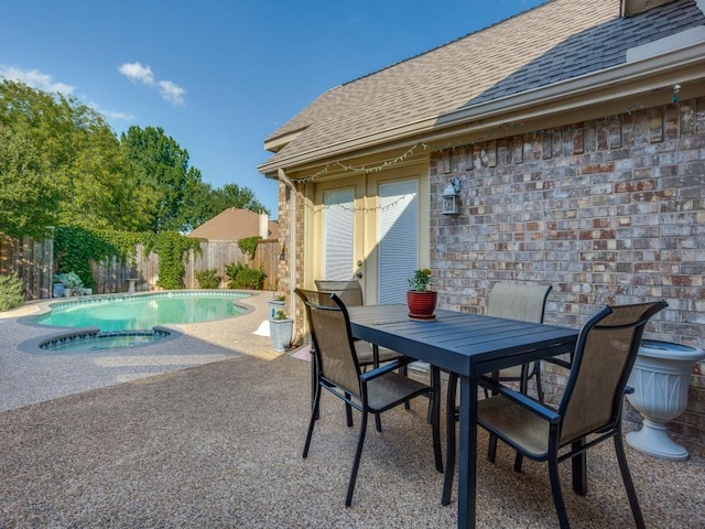 3214 Pecan Meadow Dr, Garland, TX 75040 - view of pool featuring a patio, a fenced backyard, outdoor dining area, and a pool with connected hot tub
