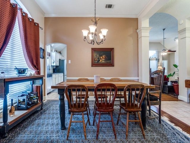 3214 Pecan Meadow Dr, Garland, TX 75040 - dining room with ceiling fan, arched walkways, crown molding, a chandelier, and decorative columns