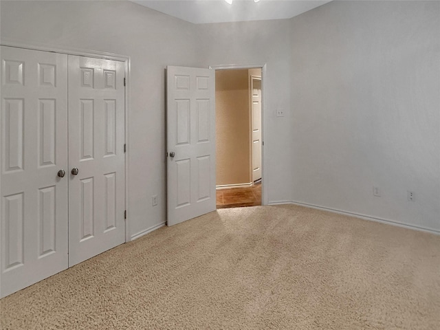 10717 Greenview Ct, Benbrook, TX 76126 - unfurnished bedroom with carpet flooring, baseboards, and a closet
