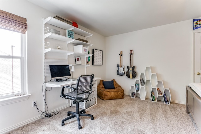 carpeted office space with baseboards