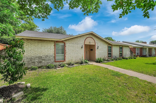 1717 Melrose St, Garland, TX 75042 - ranch-style home with brick siding and a front lawn