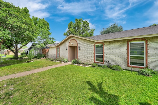 1717 Melrose St, Garland, TX 75042 - ranch-style house featuring brick siding and a front lawn