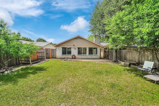 1717 Melrose St, Garland, TX 75042 - rear view of property featuring brick siding and a patio area