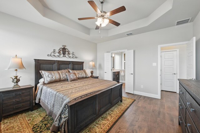 2172 Knightsgate Rd, Argyle, TX 76226 - bedroom with a raised ceiling, baseboards, dark wood finished floors, a ceiling fan, and ensuite bathroom