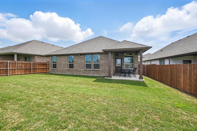 2172 Knightsgate Rd, Argyle, TX 76226 - back of property featuring a patio area, brick siding, and roof with shingles