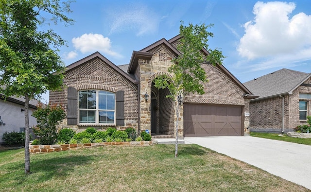 2172 Knightsgate Rd, Argyle, TX 76226 - french country inspired facade with brick siding, driveway, a front yard, and stone siding