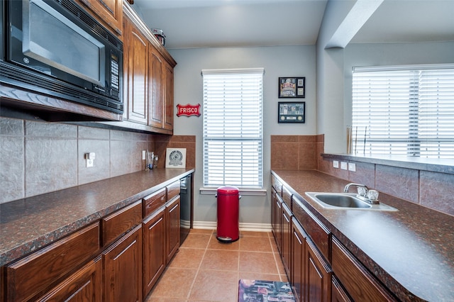 13348 Torrington Dr, Frisco, TX 75035 - kitchen featuring black microwave, a sink, dark countertops, and tasteful backsplash