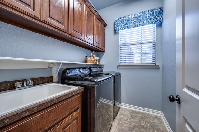 13348 Torrington Dr, Frisco, TX 75035 - laundry room featuring separate washer and dryer, baseboards, and cabinet space