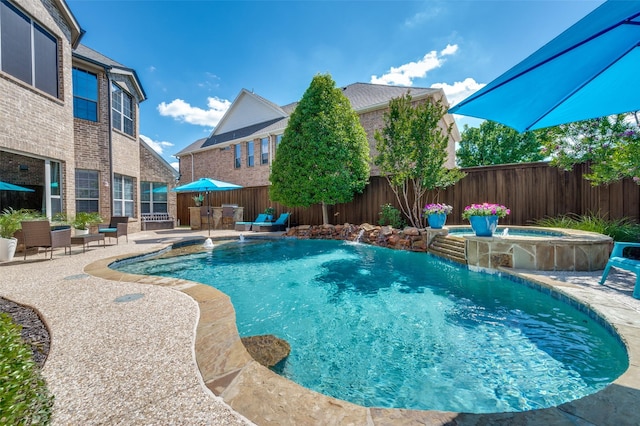 13348 Torrington Dr, Frisco, TX 75035 - view of swimming pool with a patio, fence, and a pool with connected hot tub