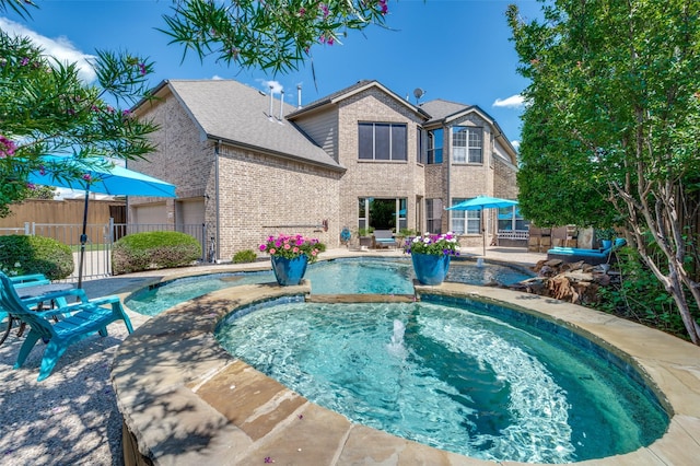 13348 Torrington Dr, Frisco, TX 75035 - view of swimming pool featuring fence, a patio area, and a pool with connected hot tub