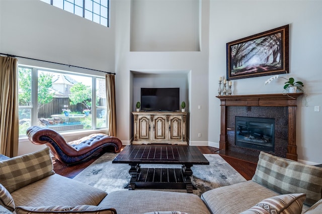 13348 Torrington Dr, Frisco, TX 75035 - living room with wood finished floors, plenty of natural light, a towering ceiling, and a fireplace