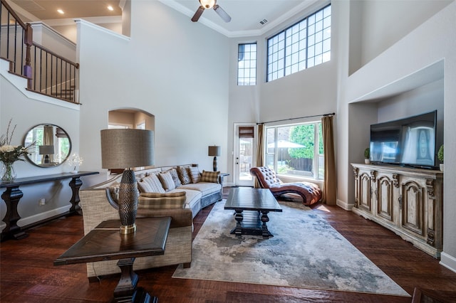 13348 Torrington Dr, Frisco, TX 75035 - living room with crown molding, ceiling fan, a high ceiling, wood finished floors, and baseboards