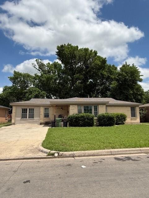 3524 Paramount St, North Richland Hills, TX 76117 - ranch-style house featuring concrete driveway and a front lawn