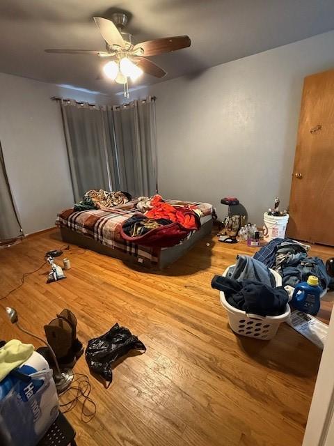3524 Paramount St, North Richland Hills, TX 76117 - unfurnished bedroom featuring wood finished floors and ceiling fan