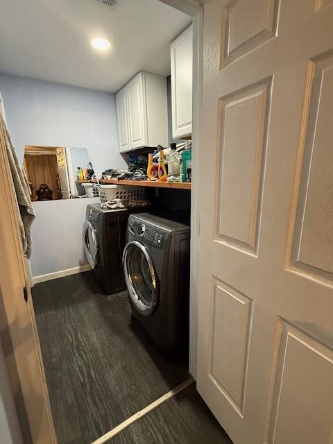 3524 Paramount St, North Richland Hills, TX 76117 - laundry area featuring cabinet space, washing machine and clothes dryer, and dark wood-type flooring