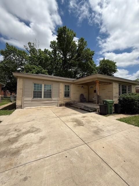 3524 Paramount St, North Richland Hills, TX 76117 - ranch-style house featuring concrete driveway and brick siding