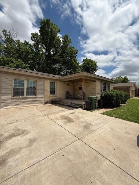 3524 Paramount St, North Richland Hills, TX 76117 - rear view of property featuring a patio and brick siding