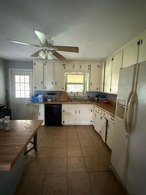 3524 Paramount St, North Richland Hills, TX 76117 - kitchen with white refrigerator with ice dispenser, dishwasher, healthy amount of natural light, and tile patterned floors