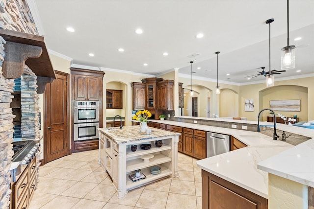 1085 Forest Bend Ct, Cross Roads, TX 76227 - kitchen with open shelves, arched walkways, ornamental molding, a large island with sink, and stainless steel appliances