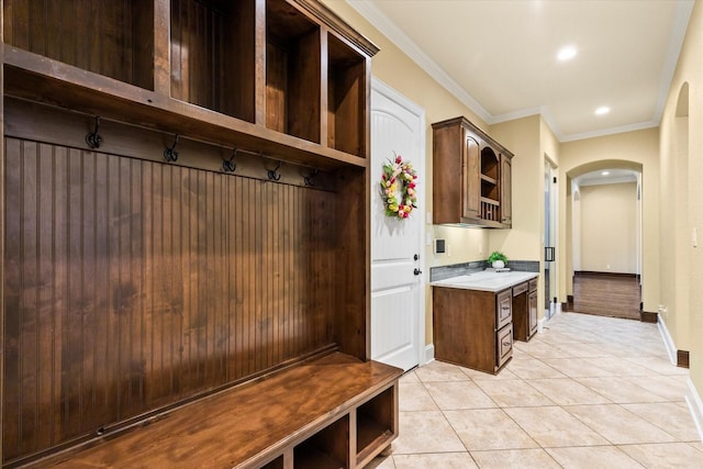 1085 Forest Bend Ct, Cross Roads, TX 76227 - mudroom with arched walkways, light tile patterned floors, baseboards, ornamental molding, and recessed lighting