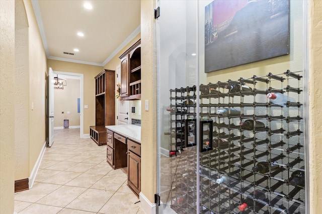 1085 Forest Bend Ct, Cross Roads, TX 76227 - wine cellar with crown molding, light tile patterned floors, recessed lighting, and baseboards