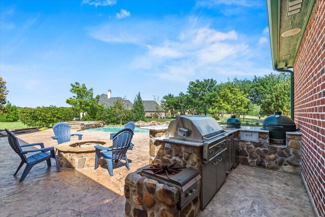 1085 Forest Bend Ct, Cross Roads, TX 76227 - view of patio with grilling area, an outdoor kitchen, a fire pit, and a pool with connected hot tub