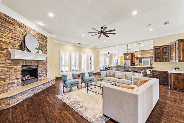 1085 Forest Bend Ct, Cross Roads, TX 76227 - living room featuring ceiling fan, ornamental molding, recessed lighting, a fireplace, and dark wood-style flooring