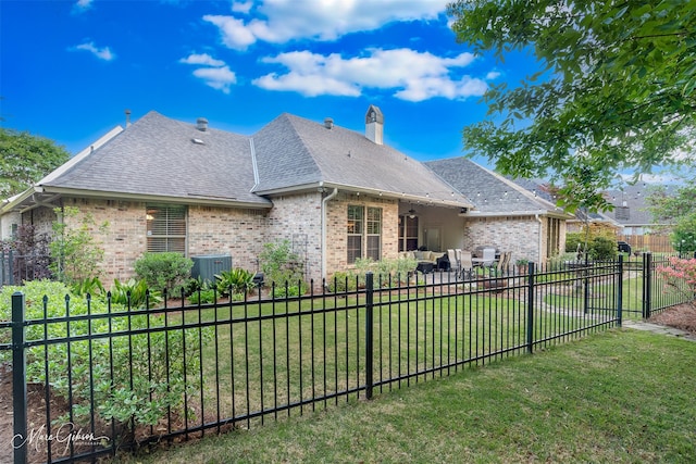 27 Wilshire Dr, Bossier City, LA 71111 - back of property featuring brick siding, a shingled roof, a chimney, and central air condition unit