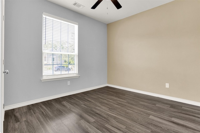 421 E Shepherd St, Denison, TX 75021 - empty room featuring a ceiling fan, dark wood-style floors, and baseboards