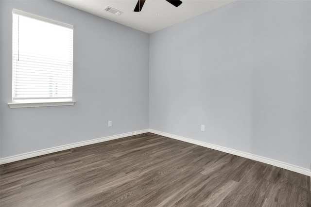 421 E Shepherd St, Denison, TX 75021 - unfurnished room featuring a ceiling fan, dark wood-style floors, and baseboards
