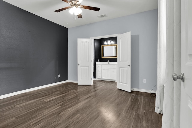 421 E Shepherd St, Denison, TX 75021 - unfurnished bedroom with dark wood-style floors, baseboards, a sink, and a ceiling fan