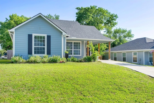 421 E Shepherd St, Denison, TX 75021 - view of front of house with a front yard, driveway, and roof with shingles