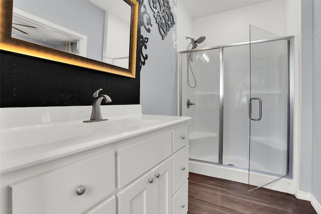 421 E Shepherd St, Denison, TX 75021 - bathroom with a shower stall, wood finished floors, and vanity