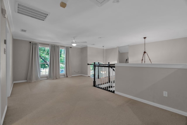 spare room featuring baseboards, carpet flooring, and ceiling fan