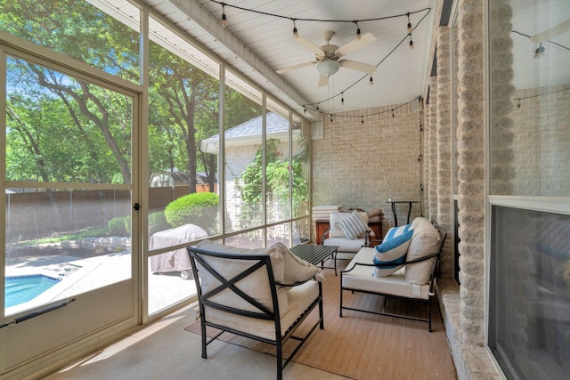 sunroom with ceiling fan and plenty of natural light