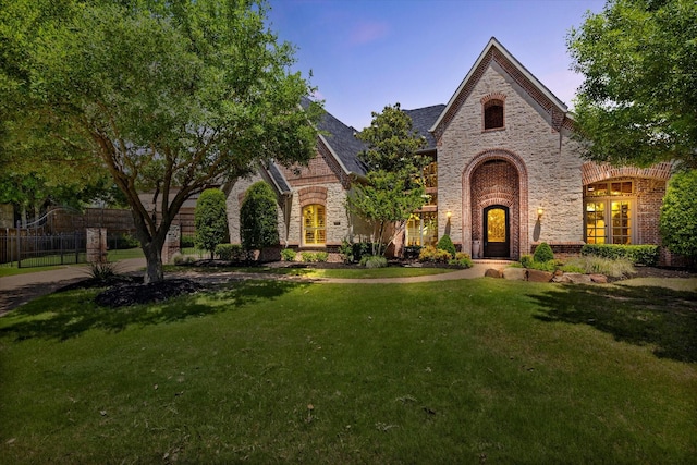 view of front of home with brick siding and stone siding