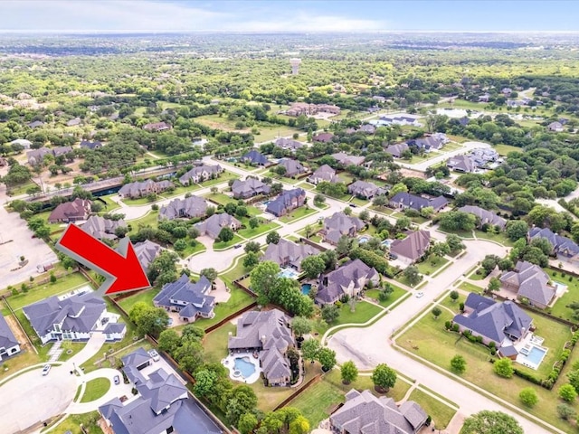 aerial view of property's location with nearby suburban area