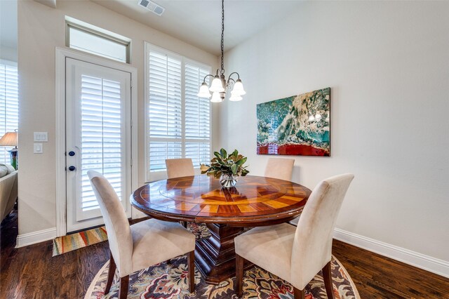 3020 Speyburn, The Colony, TX 75056 - dining area with a chandelier, baseboards, plenty of natural light, and dark wood-type flooring