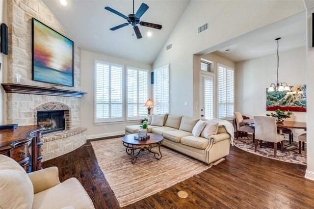 3020 Speyburn, The Colony, TX 75056 - living room with ceiling fan, wood finished floors, a chandelier, high vaulted ceiling, and a fireplace