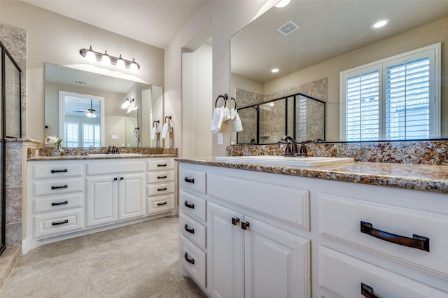 3020 Speyburn, The Colony, TX 75056 - full bath with a stall shower, two vanities, a ceiling fan, and tile patterned flooring