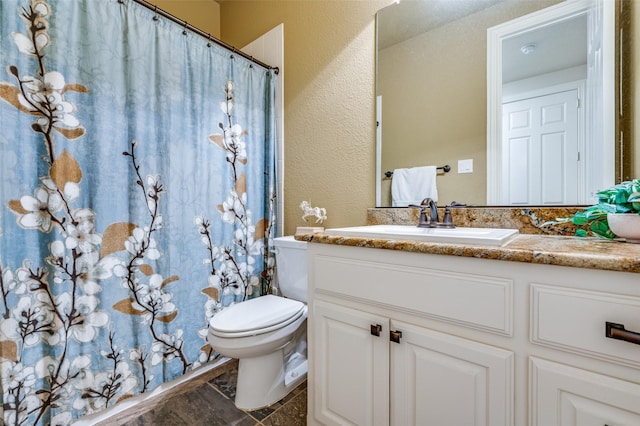 3020 Speyburn, The Colony, TX 75056 - bathroom with a textured wall, toilet, vanity, and a shower with shower curtain