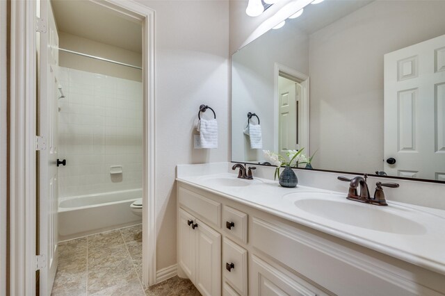 3020 Speyburn, The Colony, TX 75056 - bathroom with double vanity, toilet, and shower / washtub combination