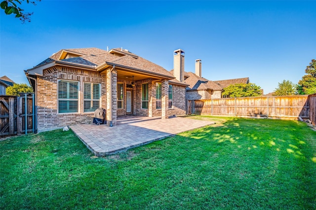 3020 Speyburn, The Colony, TX 75056 - rear view of property with brick siding, a chimney, roof with shingles, a patio area, and ceiling fan