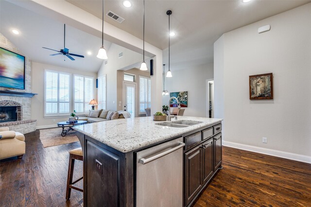 3020 Speyburn, The Colony, TX 75056 - kitchen with stainless steel dishwasher, a sink, open floor plan, baseboards, and recessed lighting